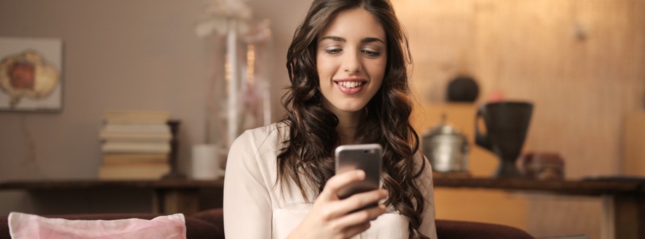 woman looking at phone screen