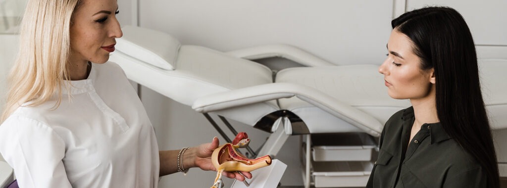 two women sitting in chairs in a doctor's office